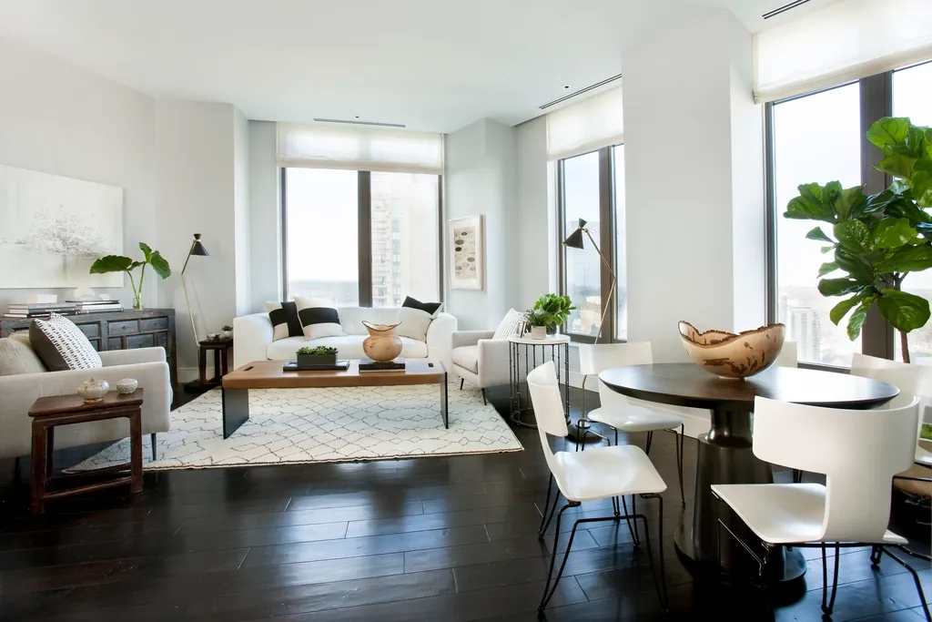 Open living and dining room with dark hardwood floors