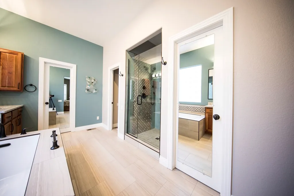 Completed bathroom with a walk-in glass shower