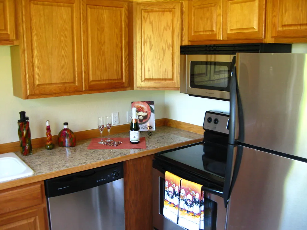 Original kitchen with dated oak cabinetry