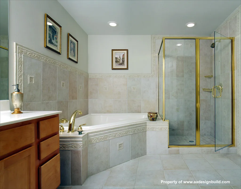 Bathroom with a glass-enclosed shower and soaking tub